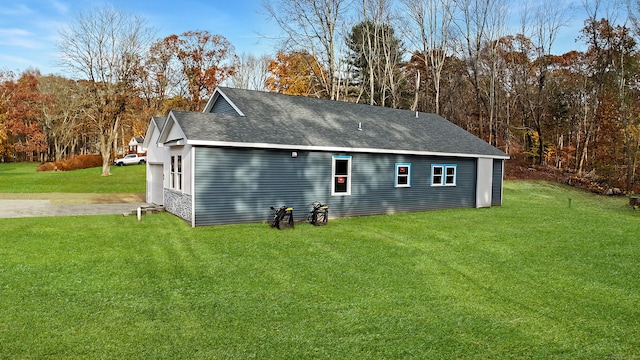 view of property exterior with a lawn