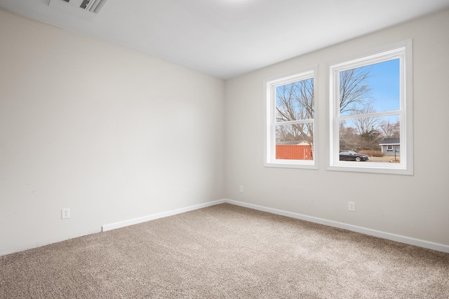 empty room featuring carpet flooring