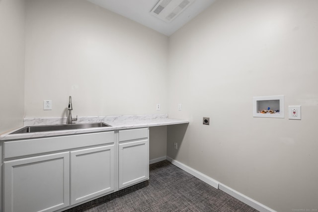 clothes washing area featuring cabinets, hookup for a washing machine, electric dryer hookup, sink, and dark colored carpet