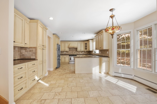 kitchen with pendant lighting, stainless steel appliances, sink, backsplash, and custom range hood