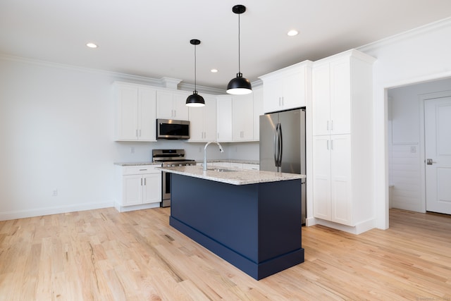 kitchen with sink, white cabinets, and appliances with stainless steel finishes