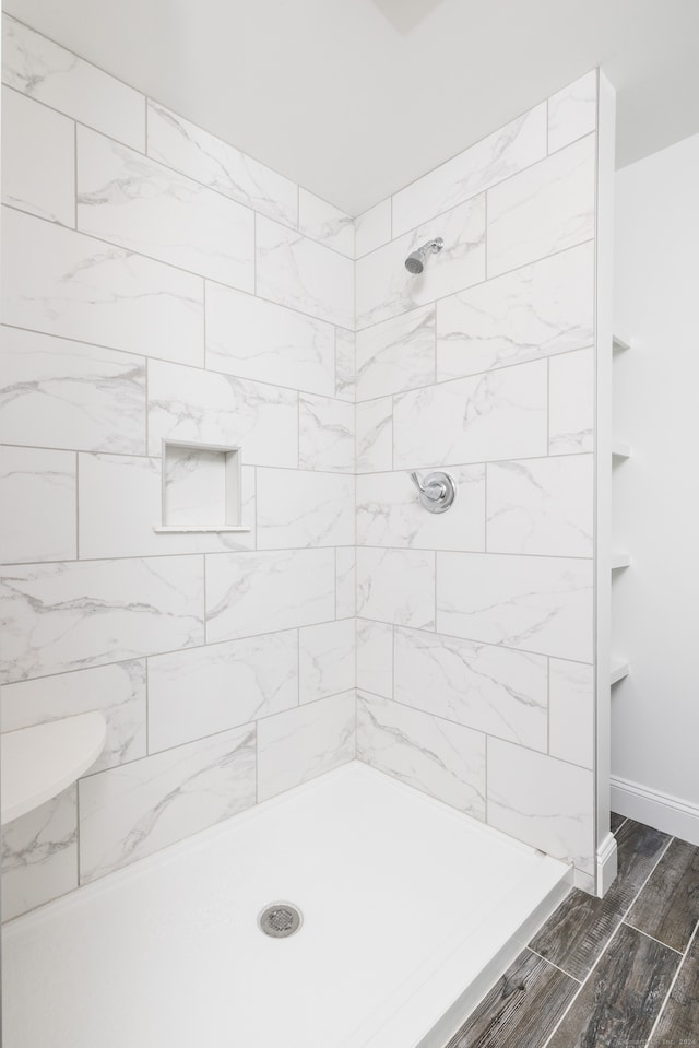 bathroom with a tile shower