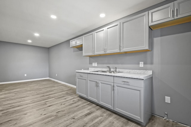 172 Quinnipiac Ave, New Haven, CT 06513 - kitchen featuring gray cabinets, light wood-type flooring, recessed lighting, and light countertops
