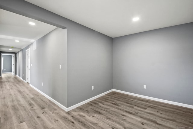 spare room with hardwood / wood-style flooring