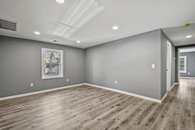 unfurnished room featuring light wood-type flooring