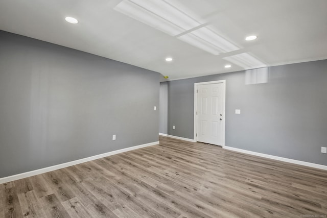 unfurnished room with light hardwood / wood-style floors