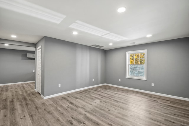 unfurnished room with light hardwood / wood-style floors