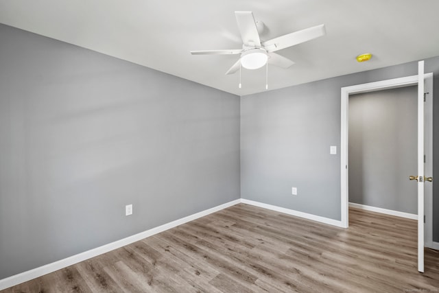 unfurnished room featuring ceiling fan and light wood-type flooring