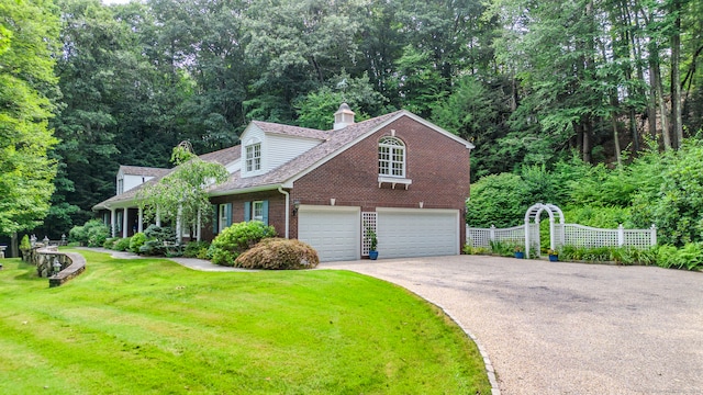 view of front of house with a garage and a front yard