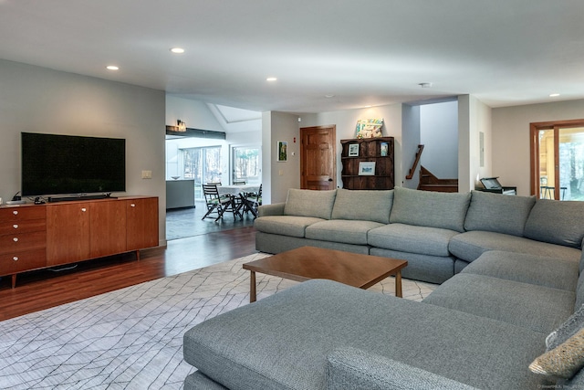 living room with plenty of natural light and hardwood / wood-style floors