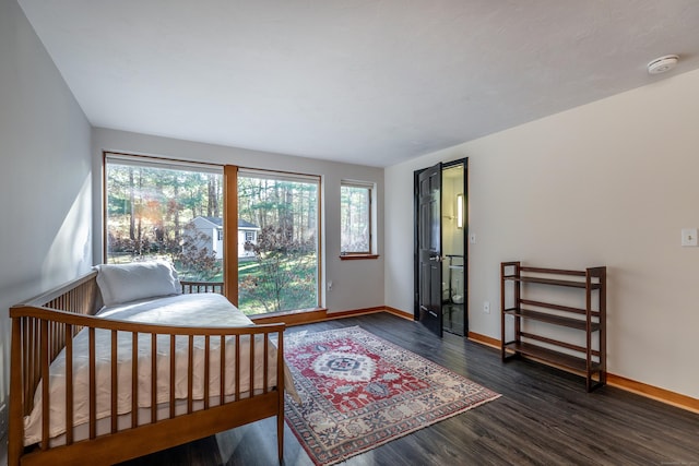 bedroom featuring dark wood-type flooring