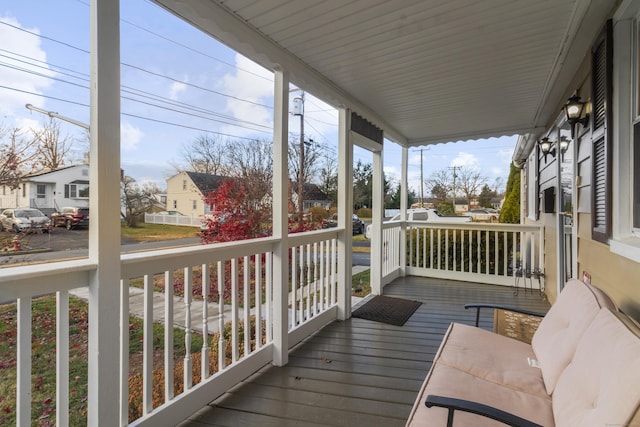 wooden terrace with a porch