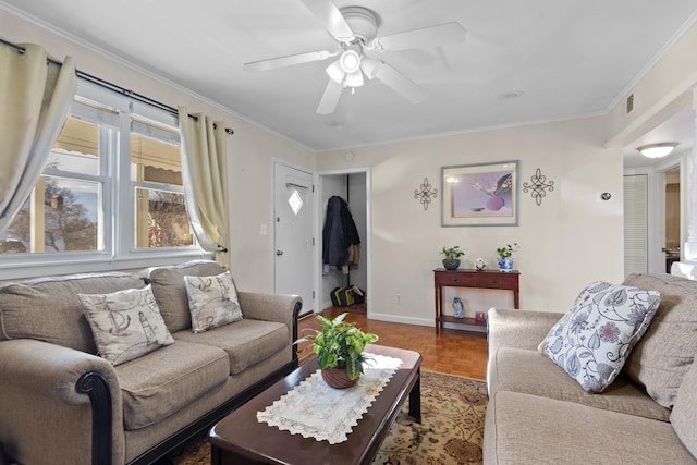 living room featuring ceiling fan, parquet flooring, and crown molding