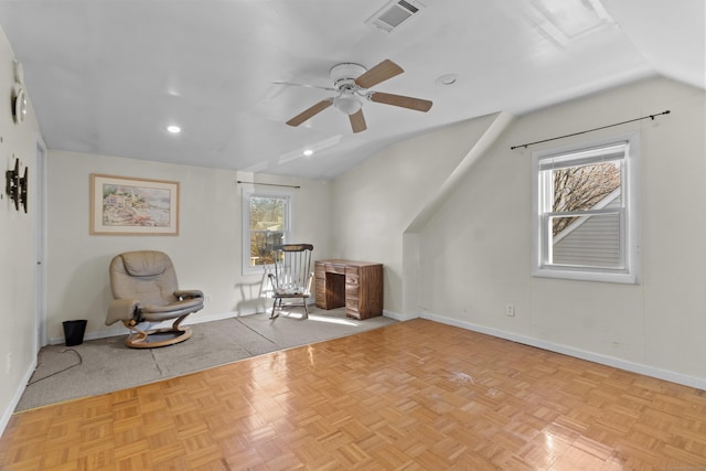 unfurnished room featuring ceiling fan, plenty of natural light, light parquet floors, and lofted ceiling