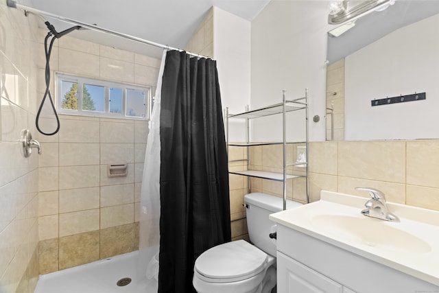 bathroom with toilet, vanity, tile walls, and walk in shower