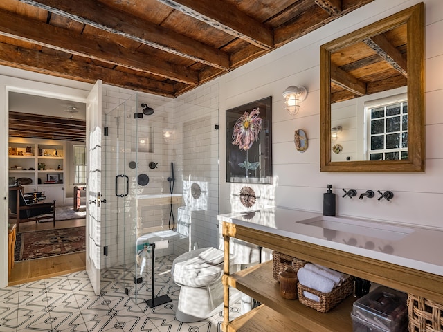 bathroom featuring wooden walls, wood ceiling, a sink, a shower stall, and beam ceiling