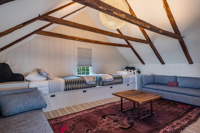 living room with a chandelier and lofted ceiling with beams