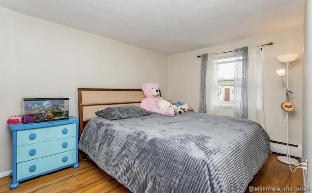 25 Liberty St Unit E, New Haven, CT 06519 - bedroom featuring a baseboard heating unit and wood finished floors