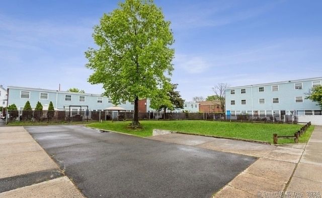 view of property's community with a yard