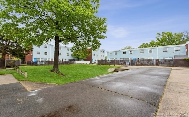 view of property's community featuring a yard