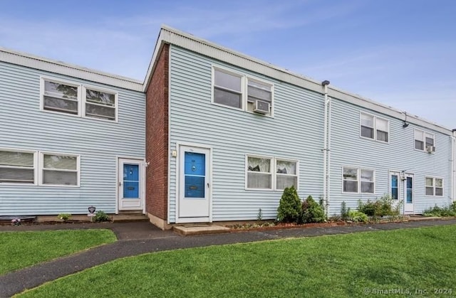 25 Liberty St Unit E, New Haven, CT 06519 - view of property featuring entry steps, a front lawn, and cooling unit