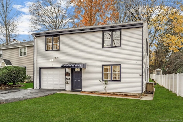 view of front of home featuring a garage and a front yard