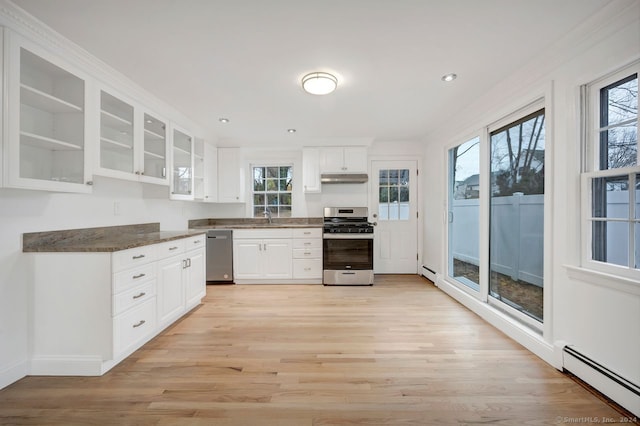 kitchen with white cabinets, plenty of natural light, and stainless steel appliances