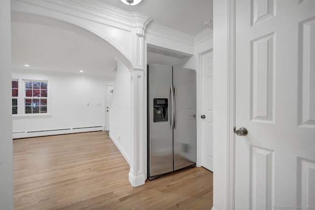 corridor featuring light wood-type flooring, a baseboard radiator, and ornamental molding