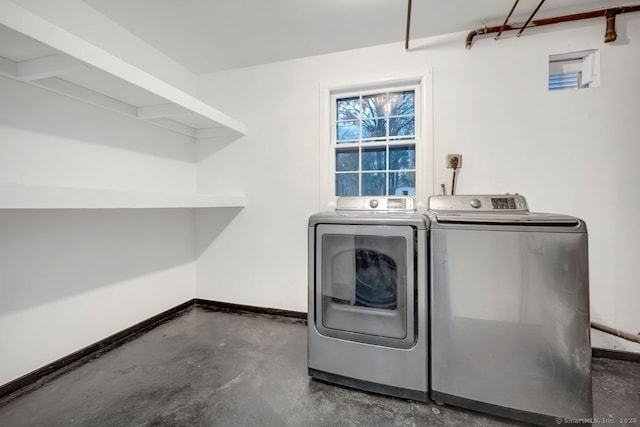 laundry room with independent washer and dryer