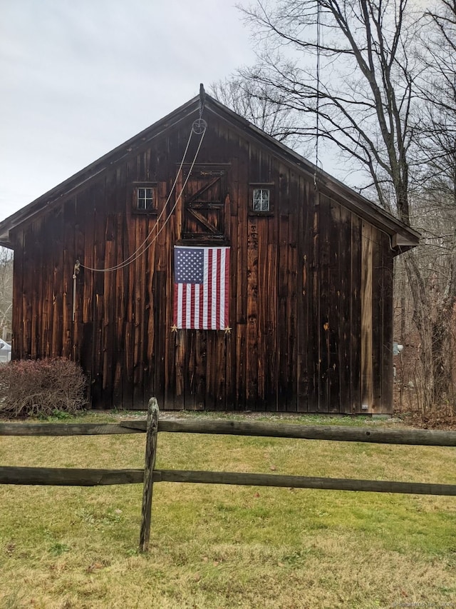 exterior space with an outbuilding and a yard