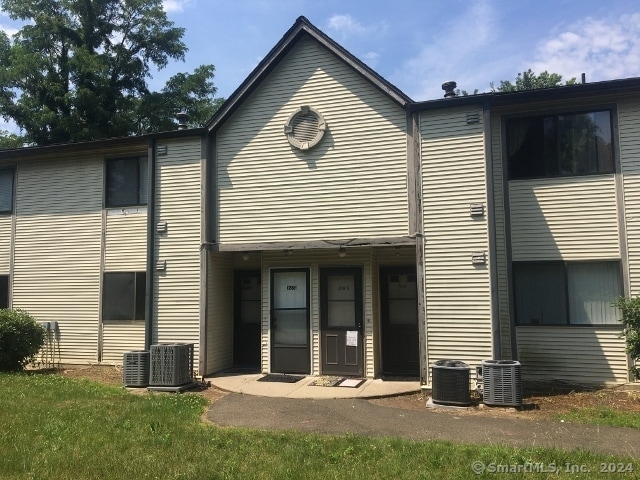 back of property with central AC