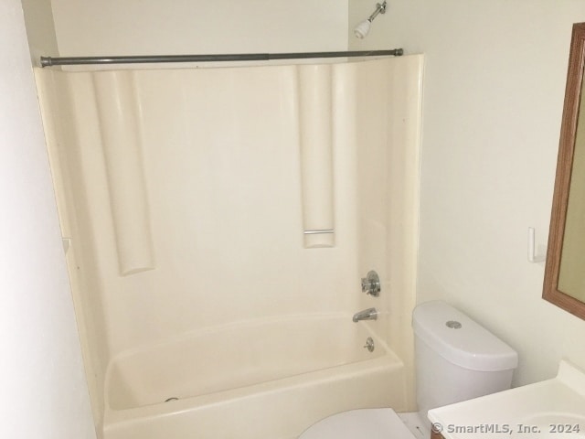 full bathroom featuring shower / bathing tub combination, vanity, and toilet