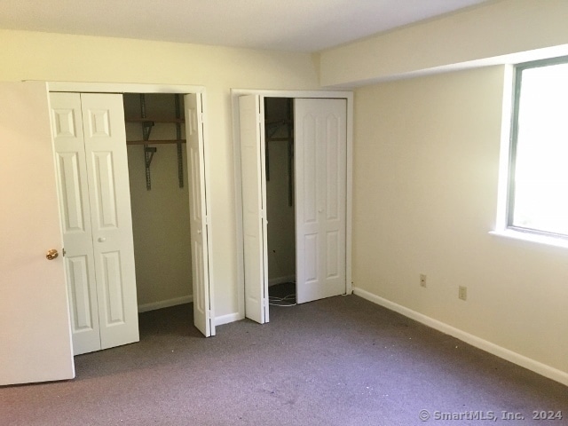 unfurnished bedroom with carpet