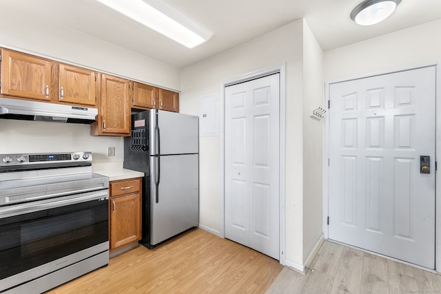 kitchen featuring light hardwood / wood-style floors and appliances with stainless steel finishes