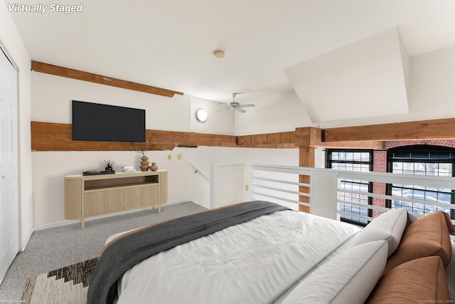 bedroom featuring carpet, ceiling fan, and vaulted ceiling