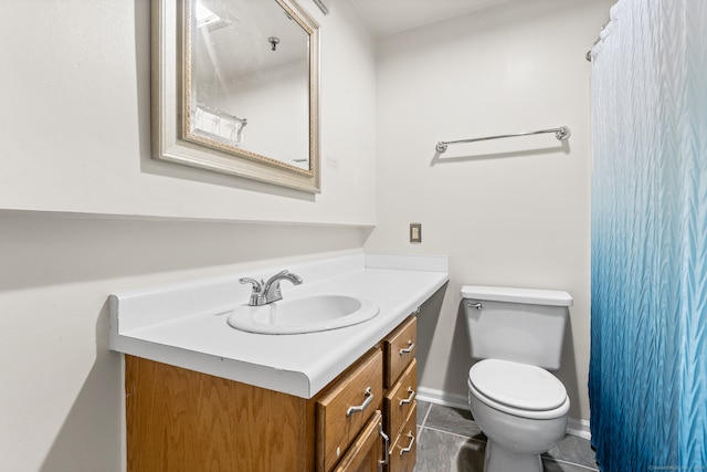 bathroom with tile patterned floors, vanity, and toilet