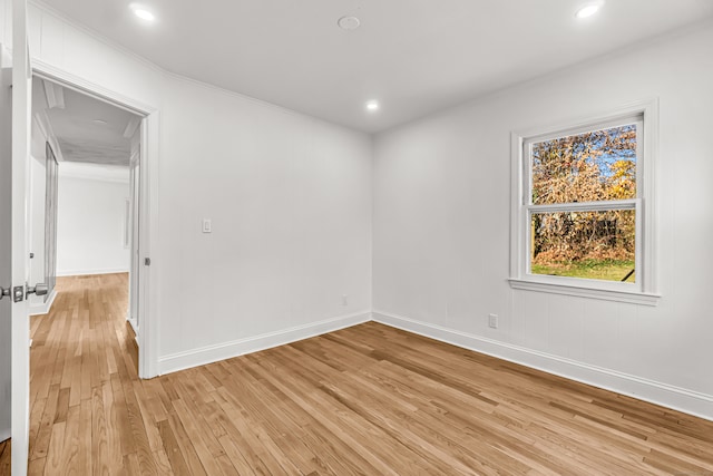 spare room featuring light hardwood / wood-style floors