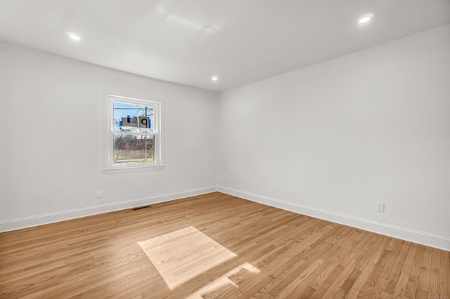 unfurnished room featuring light wood-type flooring