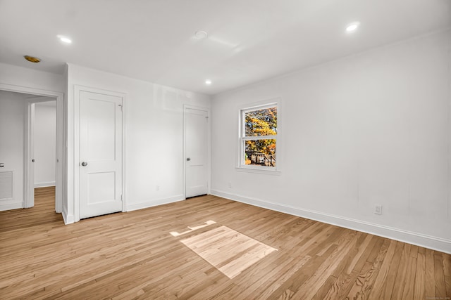 unfurnished bedroom featuring light wood-type flooring