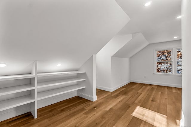 bonus room featuring hardwood / wood-style flooring