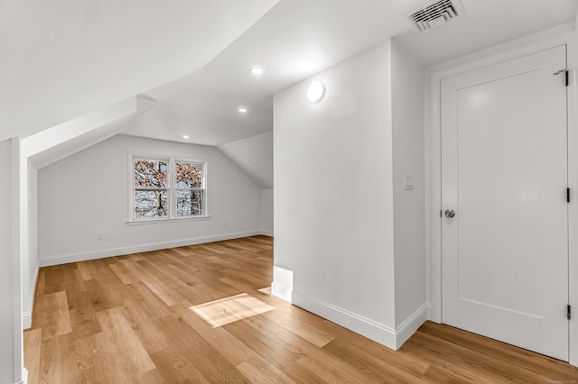 bonus room featuring light hardwood / wood-style floors and lofted ceiling