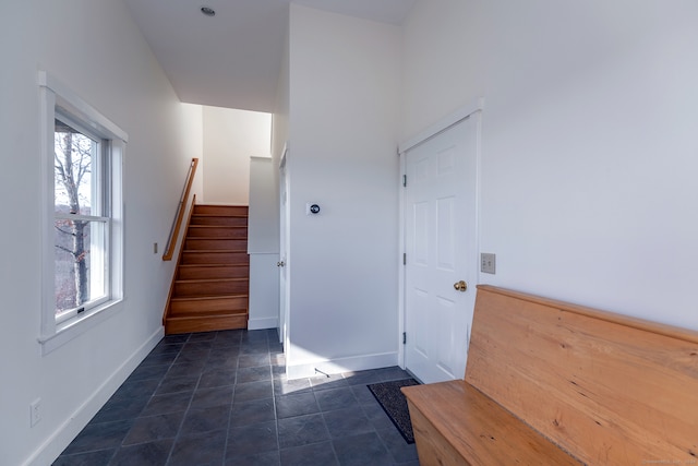 stairs with tile patterned floors