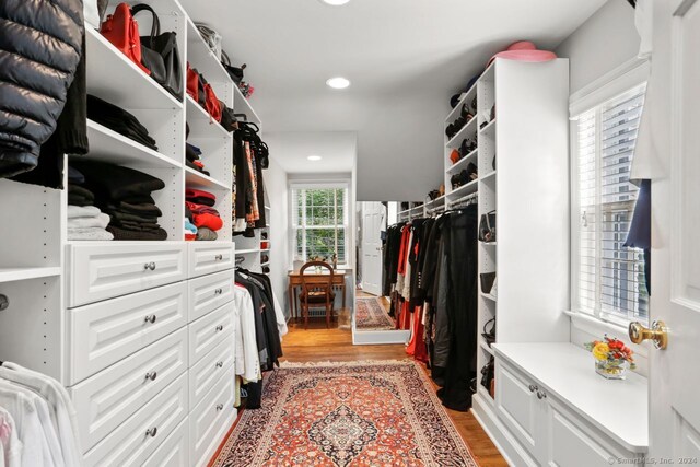 walk in closet featuring light hardwood / wood-style flooring