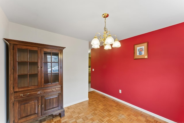27 Crows Nest Ln Unit 15E, Danbury, CT 06810 - unfurnished dining area featuring baseboards and a chandelier