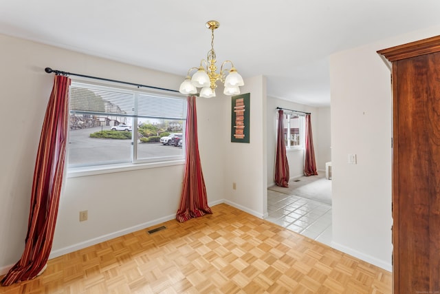 27 Crows Nest Ln Unit 15E, Danbury, CT 06810 - unfurnished room featuring baseboards, an inviting chandelier, visible vents, and a wealth of natural light
