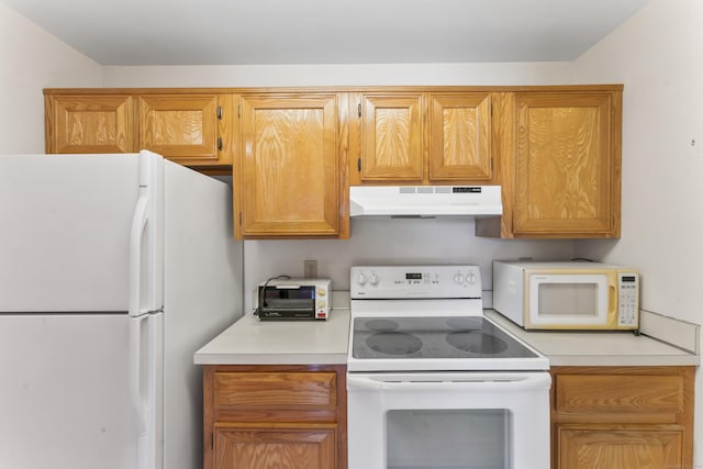 27 Crows Nest Ln Unit 15E, Danbury, CT 06810 - kitchen featuring under cabinet range hood, light countertops, white appliances, and a toaster