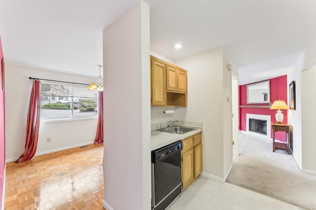 27 Crows Nest Ln Unit 15E, Danbury, CT 06810 - kitchen featuring a sink, dishwasher, light countertops, a fireplace, and baseboards
