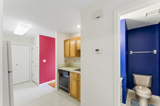 27 Crows Nest Ln Unit 15E, Danbury, CT 06810 - kitchen featuring freestanding refrigerator, recessed lighting, brown cabinets, light floors, and light countertops