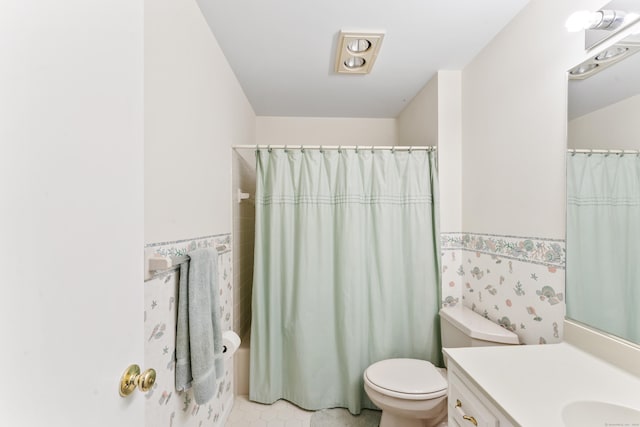 27 Crows Nest Ln Unit 15E, Danbury, CT 06810 - bathroom featuring toilet, vanity, tile walls, wainscoting, and a shower with shower curtain