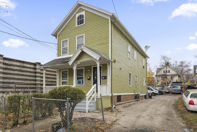 view of property featuring covered porch